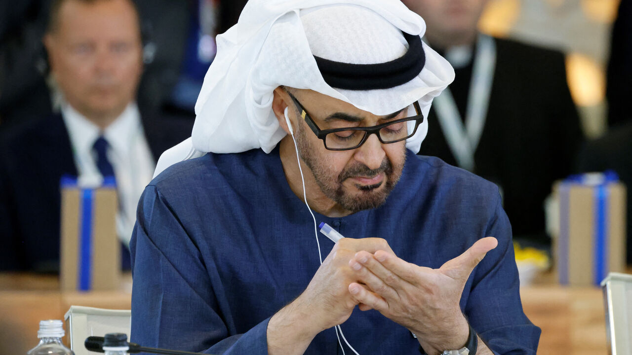 United Arab Emirates' President Sheikh Mohamed bin Zayed Al Nahyan takes notes as he attends a working session on Artificial Intelligence (AI), Energy, Africa-Mediterranean at the Borgo Egnazia resort during the G7 Summit in Savelletri near Bari, Italy, on June 14, 2024. — LUDOVIC MARIN/AFP via Getty Images