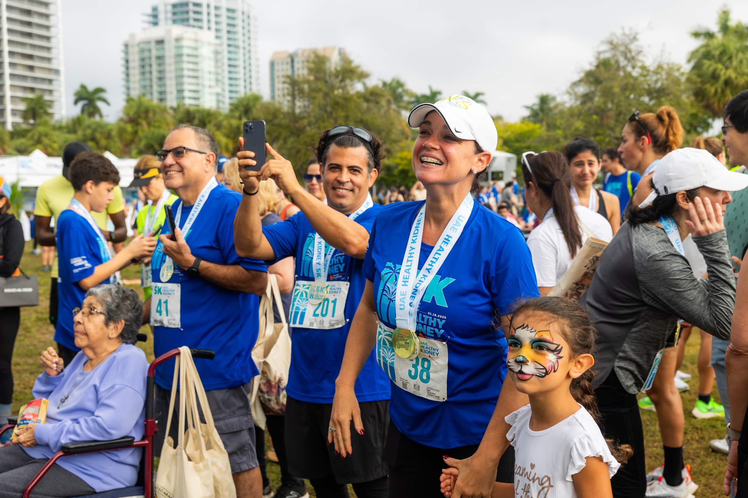 crowd of men, women, and, children smiling