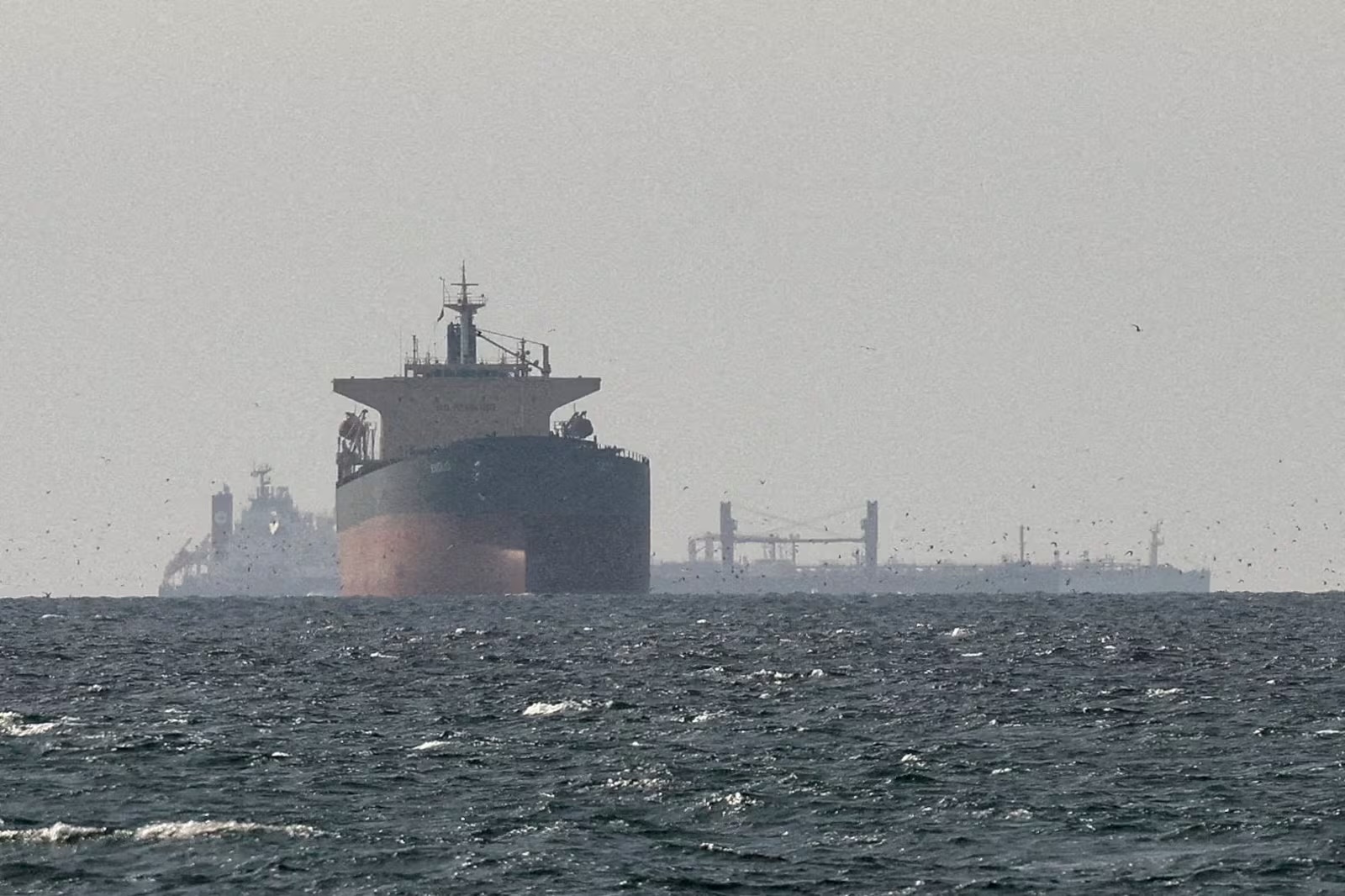 Cargo ships in the Persian Gulf near the Strait of Hormuz, as seen from northern Ras al-Khaimah, United Arab Emirates, amid the US-Israeli conflict with Iran. Picture: REUTERS/Stringer/File Photo (Stringer)