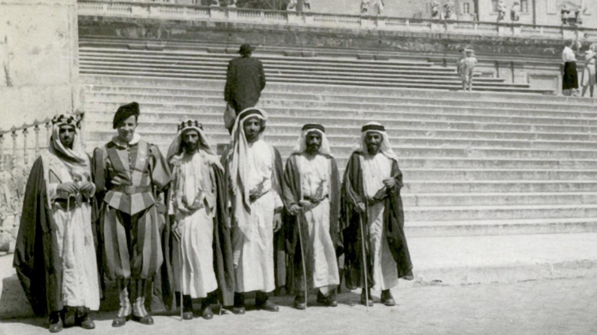 men in black and white photo