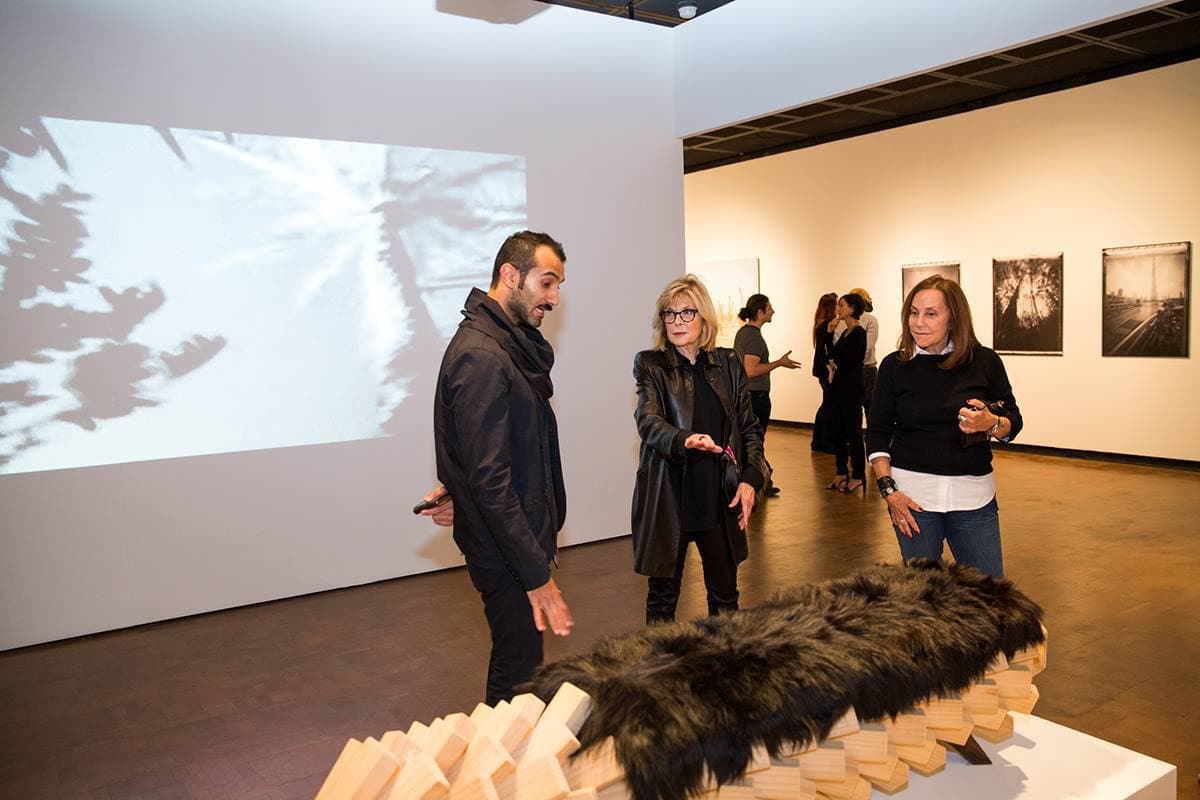 Guests enjoying the variety, creativity and innovative work by United Arab Emirates artist at the official opening of Past Forward, Contemporary Art from the Emirates at the Fowler Museum at UCLA. - Jan. 2015