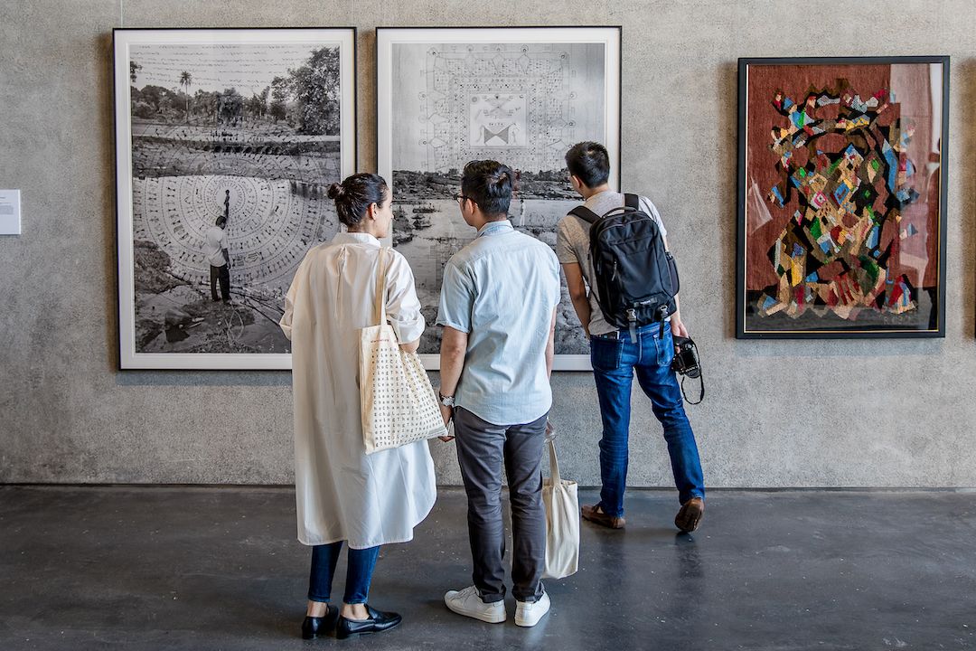 people looking at art in museum