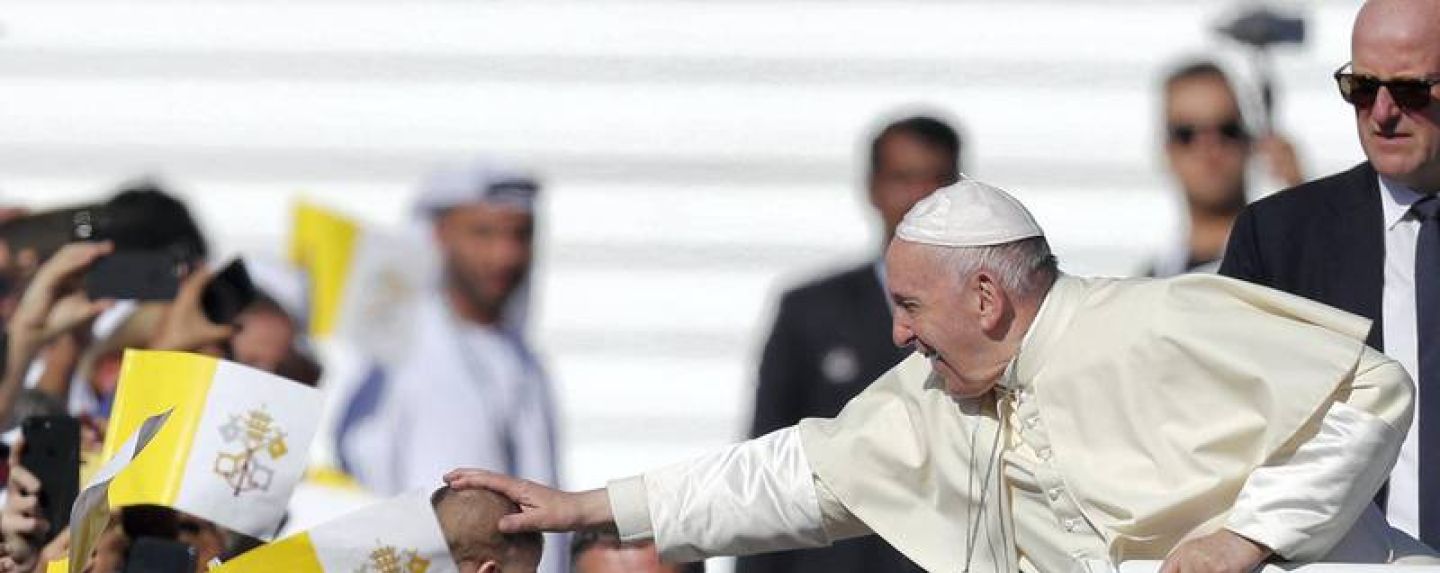 Pope Francis blesses a child. Chris Whiteoak / The National