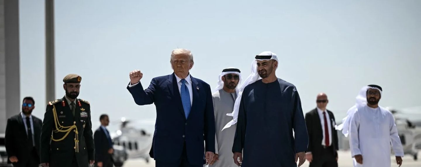 United States President Donald Trump, accompanied by his UAE counterpart Sheikh Mohamed bin Zayed Al Nahyan, gestures with a clenched fist in Abu Dhabi on May 16. Brendan Smialowski/AFP/Getty Images