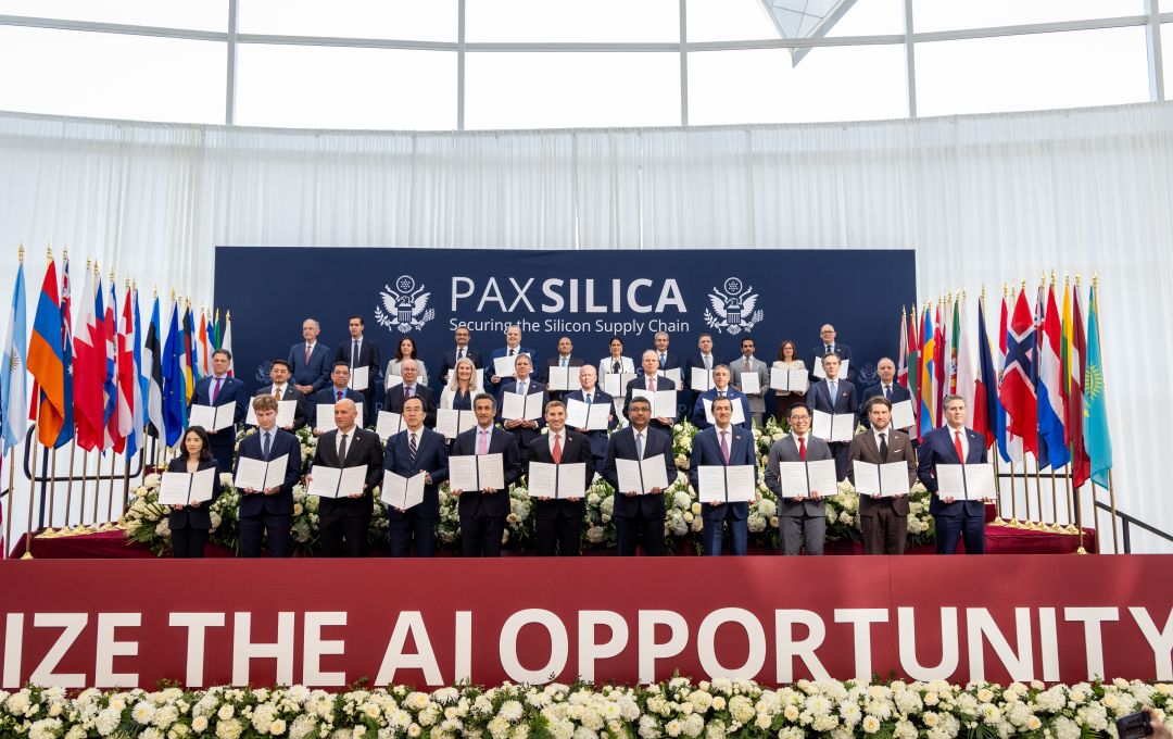 Delegates stand for a photo, each with a signed copy of the joint statement signed by thirty-five nations.