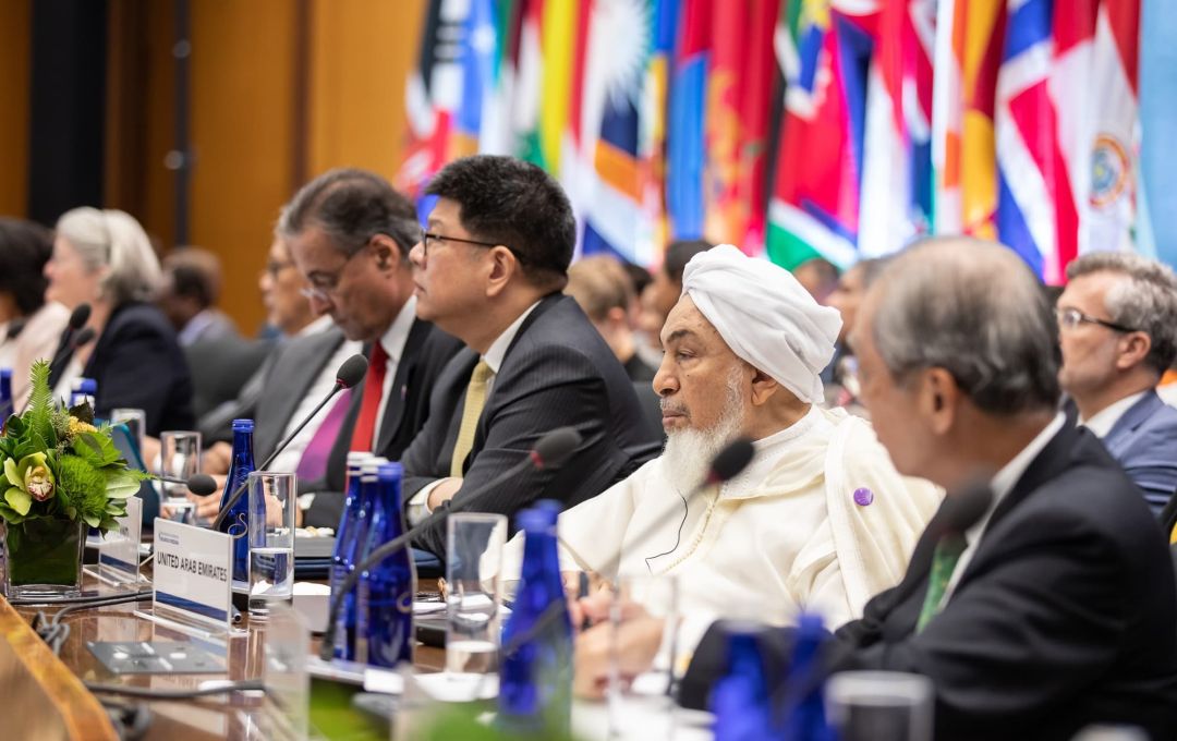 bin bayyah at conference table   big